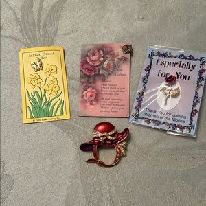 Four assorted vintage brooches red hat, butterfly cross, praying angel, red rose